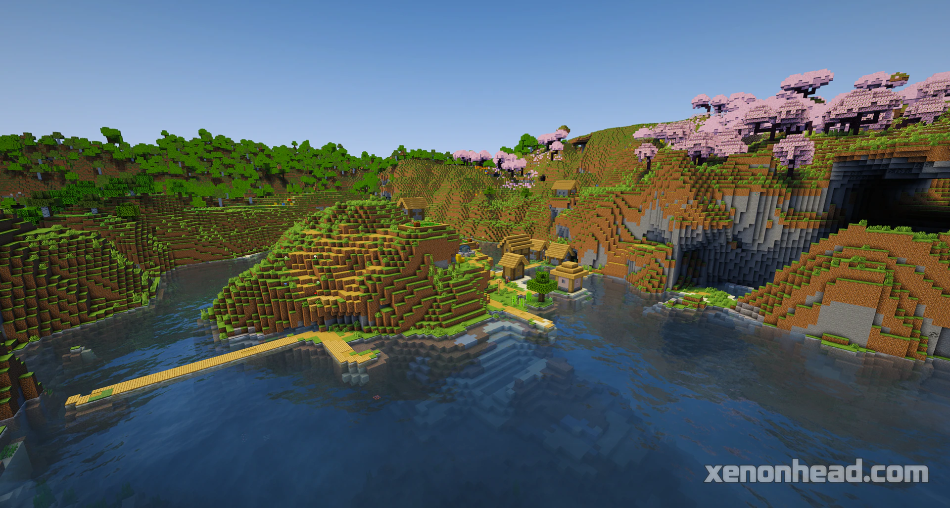 A huge pink cherry blossom crater lake with a secret hill village right in the center