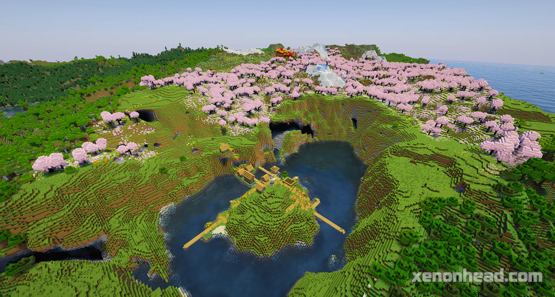 A huge pink cherry blossom crater lake with a secret hill village right in the center