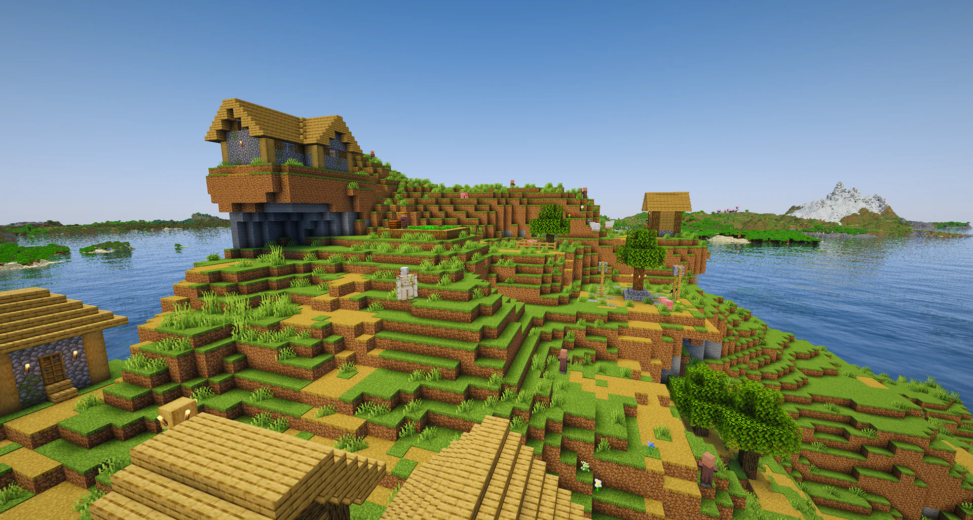A plains village on top of a towering ocean cliff