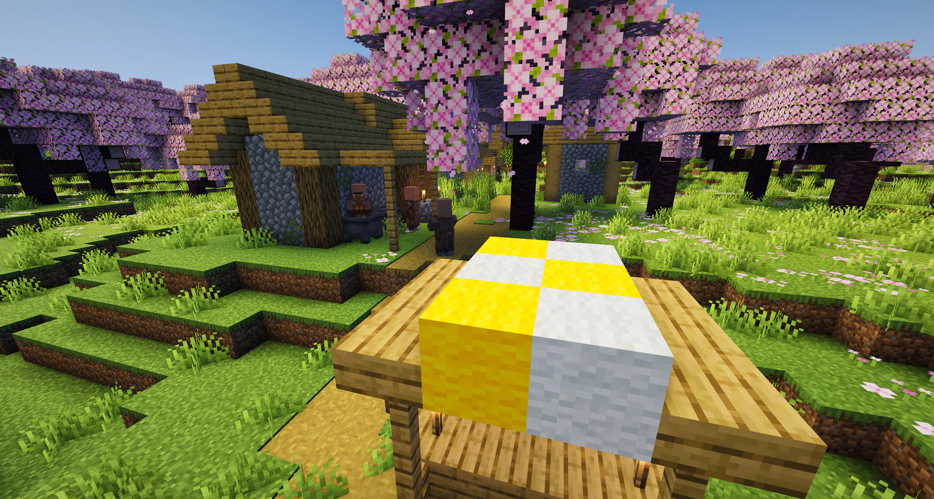 A plains village generated inside a huge pink cherry grove biome