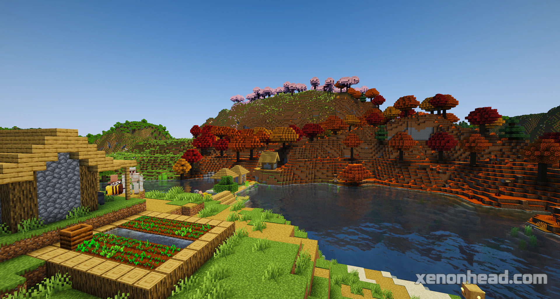A plains village on a lake island, connected by bridges next to a cherry biome