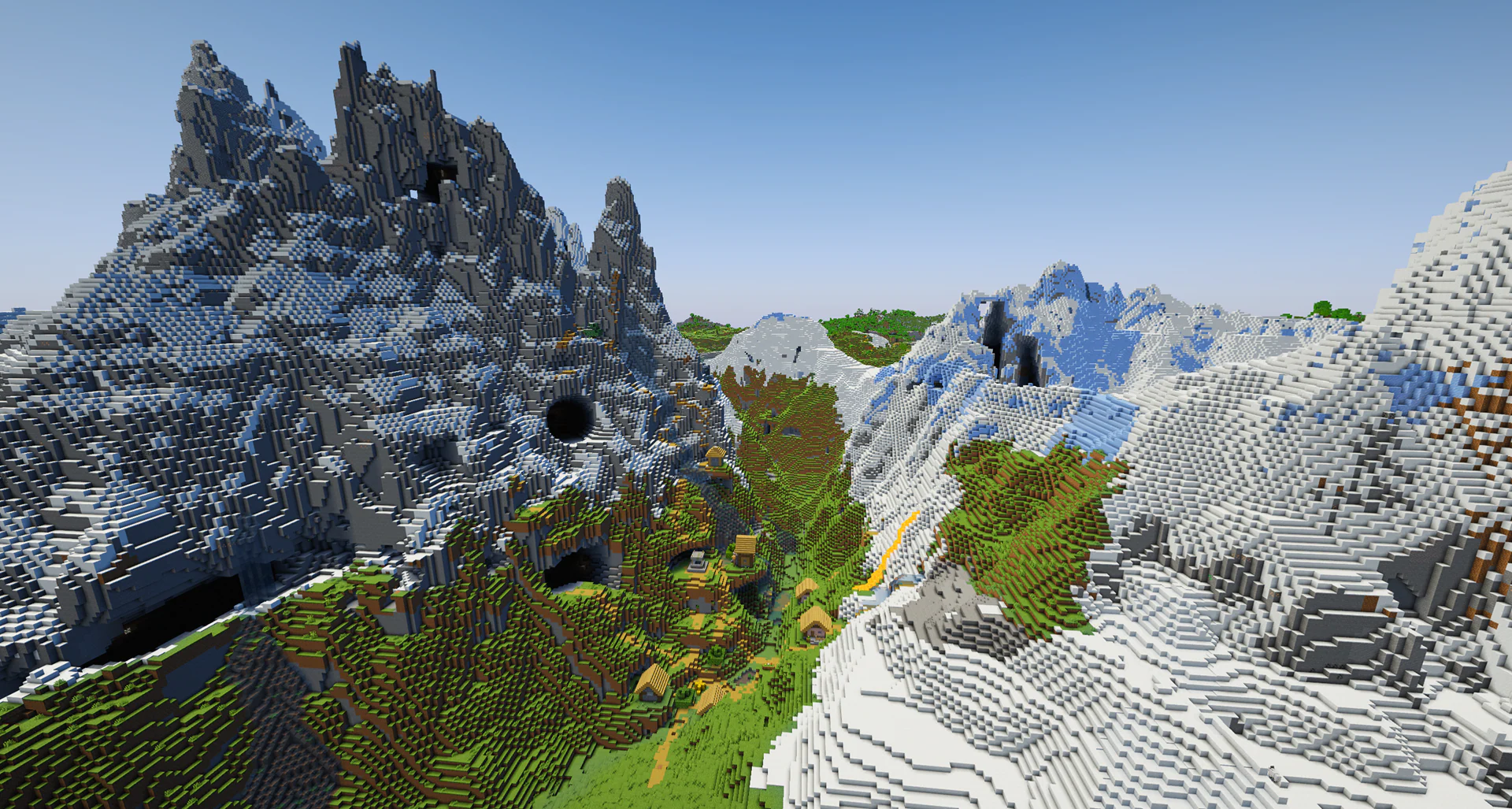 A village nestled in a valley tucked right between two huge jagged mountains