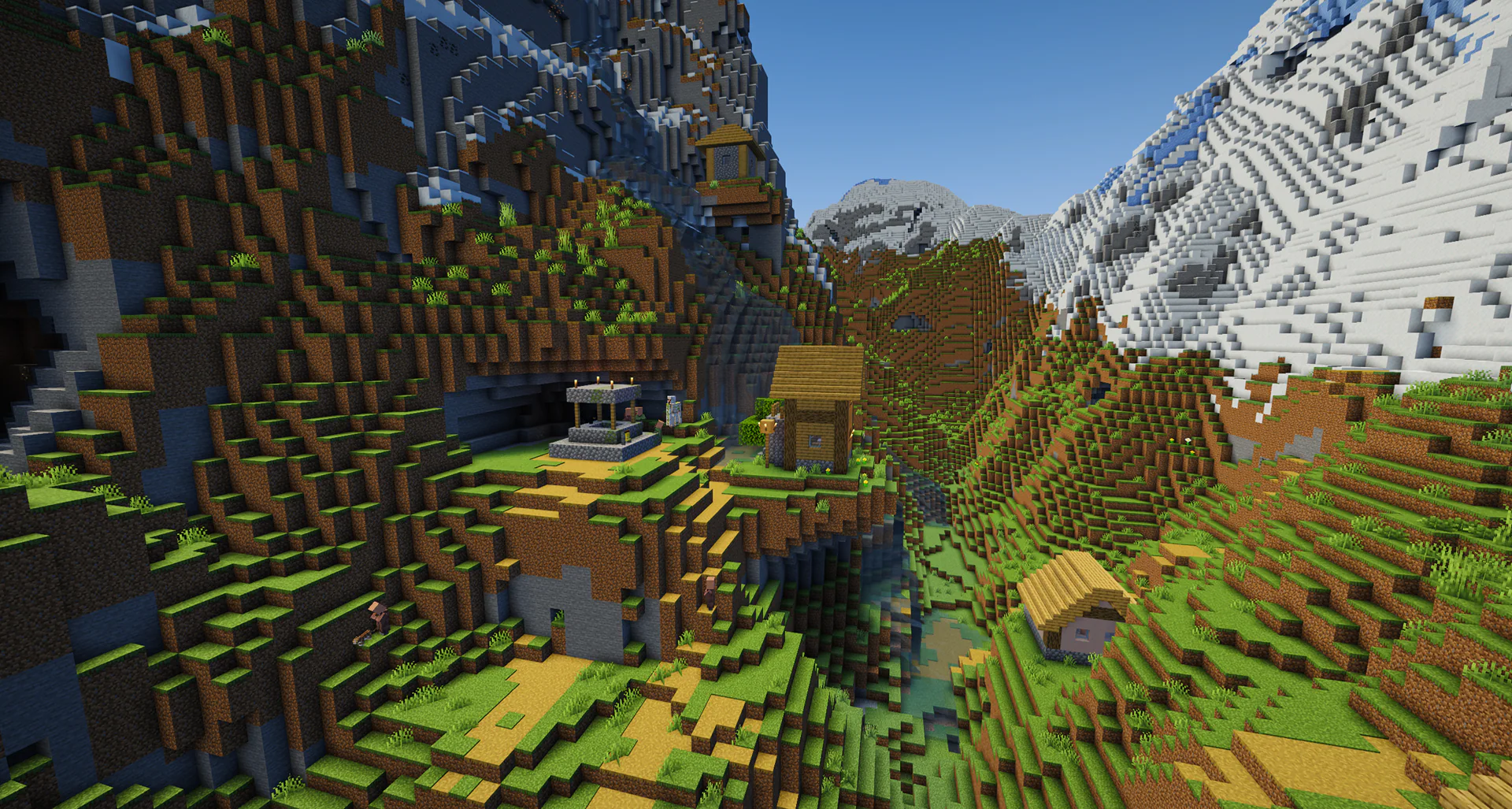 A village nestled in a valley tucked right between two huge jagged mountains