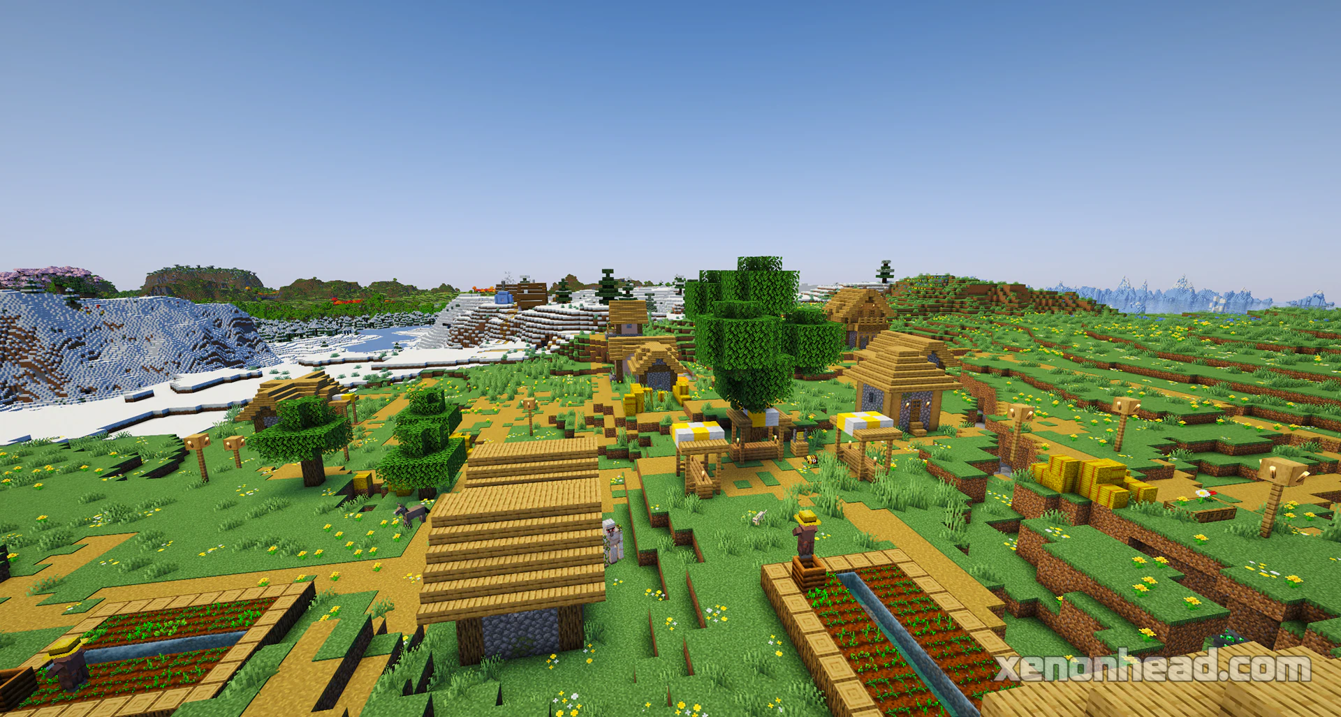 A snowy village and a plains village spawning directly on a biome border