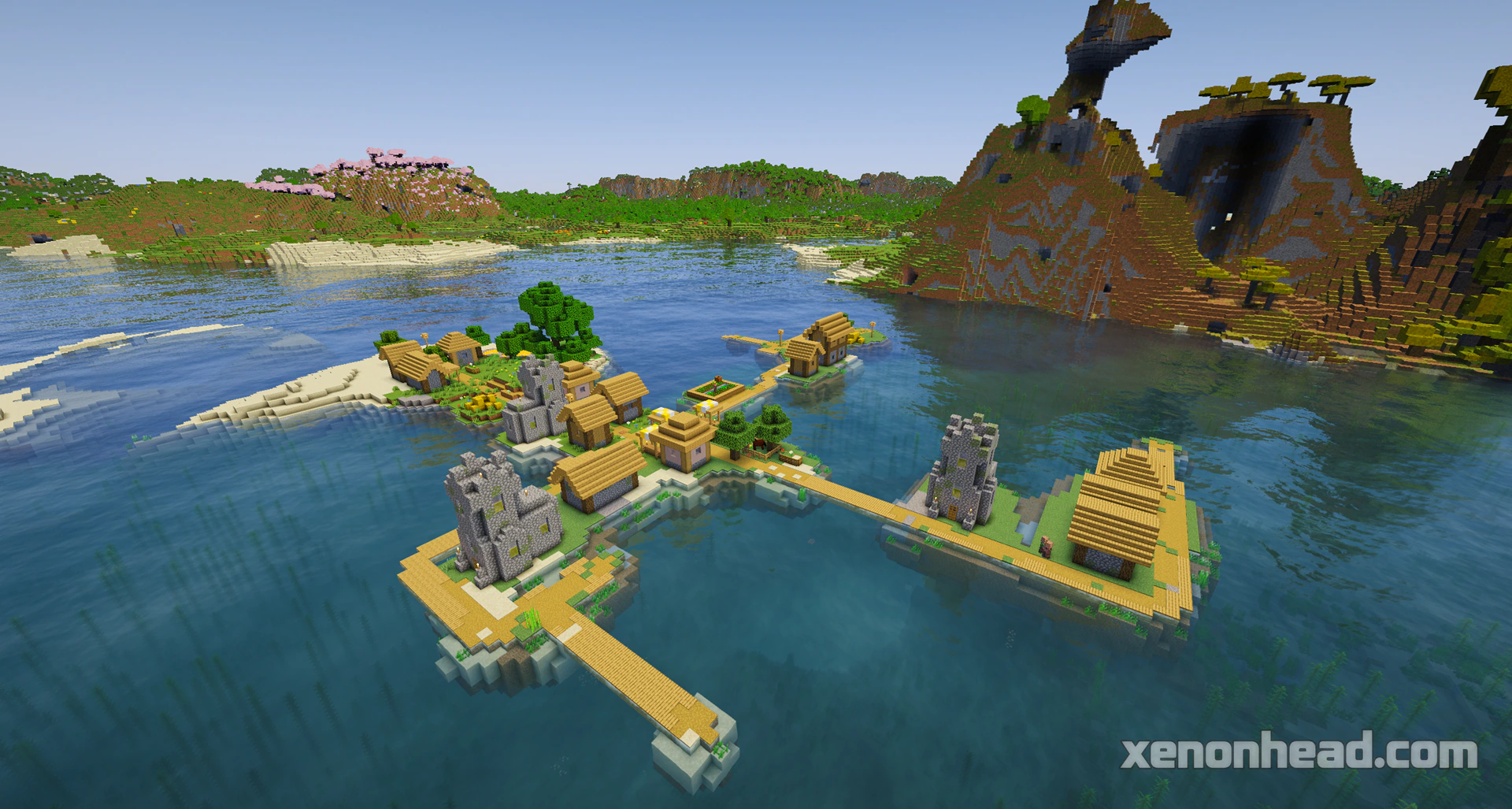 Tiny island village under large shattered peaks