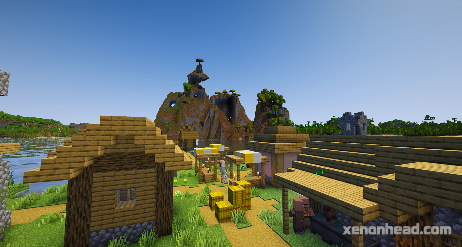 Tiny island village under large shattered peaks